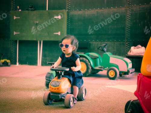 Preview: Baby Girl Playing Toy Car In Farm