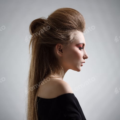 Preview: Portrait Of Woman With Stylish Hairstyle In Profile