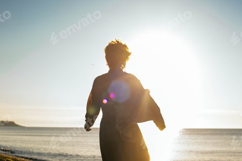 Preview: Young Caucasian Redhead Woman Walking On Beach