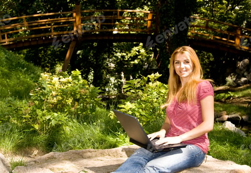 Preview: Beautiful Young Student Using Laptop In Natural Environment.