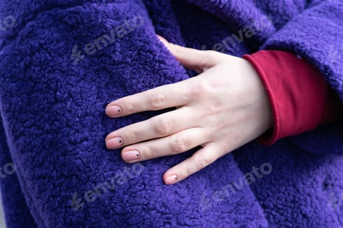 Preview: Girl'S Hand On A Purple Coat