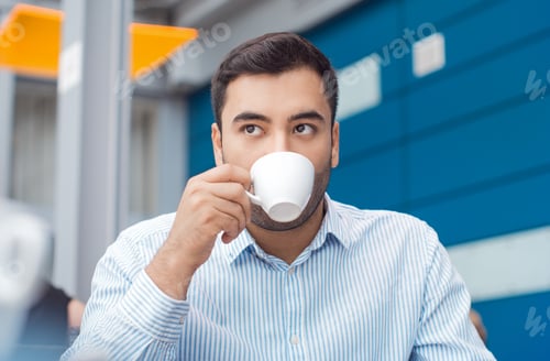 Preview: Young Man Drinking Cup Of Coffee