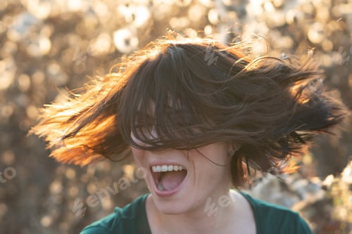 Preview: Portrait Of A Girl Shakes Her Head Standing In A Field