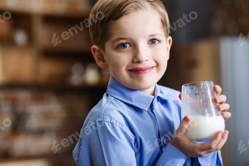 Preview: Healthy Lifestyle. Close Up Of Cheerful Smiling Little Boy Expressing Joy While Drinking Milk