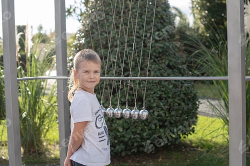 Preview: Little Boy Plays With A Pendulum