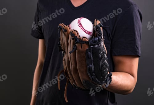 Preview: Asian Professional Baseball Player In Action. Isolated On Black Background.