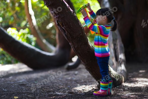 Preview: Young Girl Playing Outdoor Measure-Mate In The Forest Park For Leaning Measurement