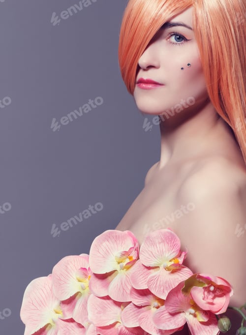 Preview: Fashion Portrait Of Beautiful Young Woman With Orchid Flowers