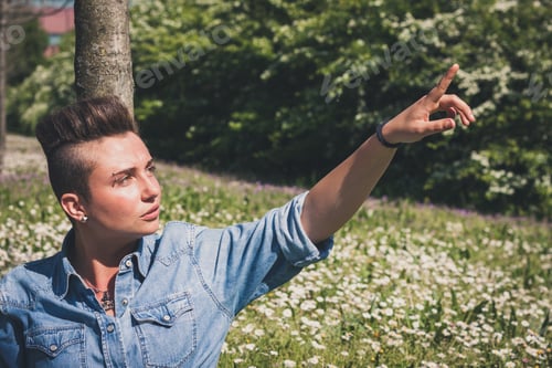 Preview: Short Hair Girl Sitting In The Grass With Flowers