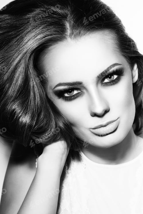 Preview: Black And White Portrait Of Young Beautiful Woman With Stylish Make-Up Touching Her Hair