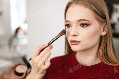 Preview: Process Of Face Makeup Brush Alignment Of The Face Tone On A Beautiful Young Woman Model Blonde