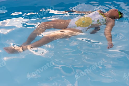 Preview: Funny Young Girl And Boys In Rainbow Glasses For Swimming Play In Blue Water Of Frame Pool