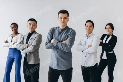Preview: Cheerful Multiracial Professional Business People Laughing Together Standing In Row Near Wall