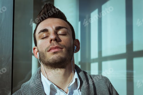 Preview: Portrait Of A Handsome Young Man Listening To Music Outdoor