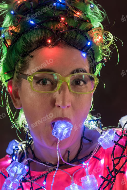Preview: A Beautiful Girl In A Pink Dress With Green Hair Decorated Herself With Christmas Garlands. Her