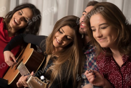 Preview: Friends Having Fun At Home Playing Guitar Drinking Beer And Singing