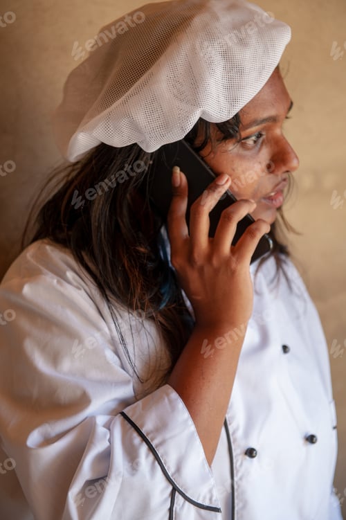 Preview: Attractive Indian Woman Cook Talking On Smartphone. Closeup Portrait Of Young Pretty Woman