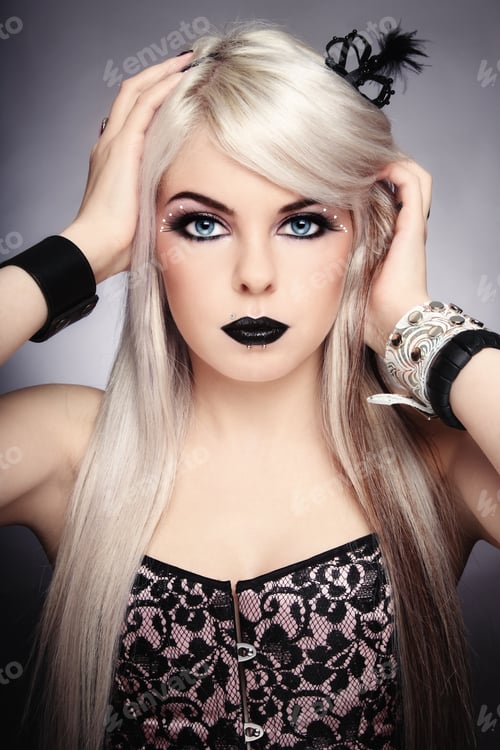Preview: Beautiful Young Sexy Blond Girl With Stylish Black Make-Up And Fancy Accessories