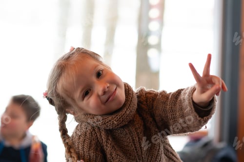 Preview: Little Girl Shows Victory