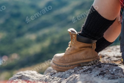 Preview: Young Woman Sitting On Cliff And Enjoy The View. A Girl In A Kilt, A Scandinavian Mood. Crimea