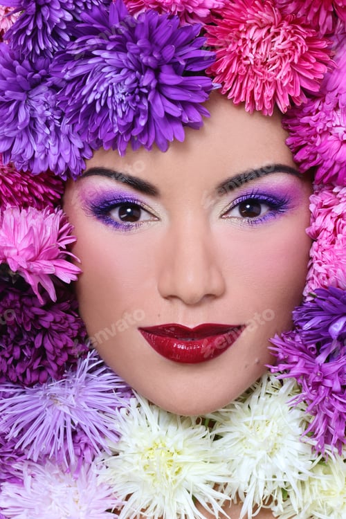 Preview: Portrait Of Beautiful Girl With Stylish Makeup And Bright Flowers Around Her Face