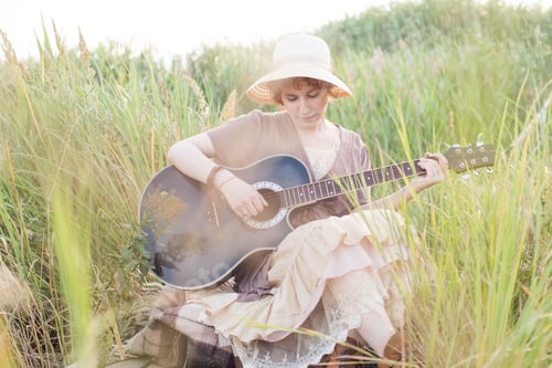 Preview: Redhead Woman With Guitar