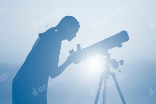 Preview: Silhouette Of A Woman Against Beautiful Romantic Sunset Sky With Clouds. A Woman Looks At The Sky