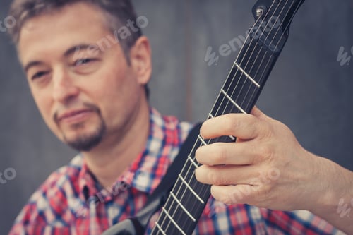 Preview: Man In Short Sleeve Shirt Playing Electric Guitar In The Street