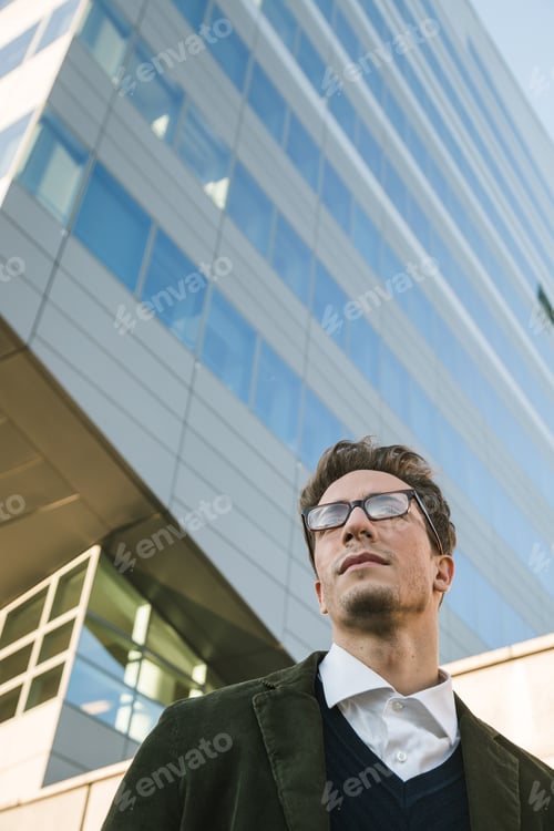 Preview: Young Handsome Man With Short Hair Posing In An Urban Context