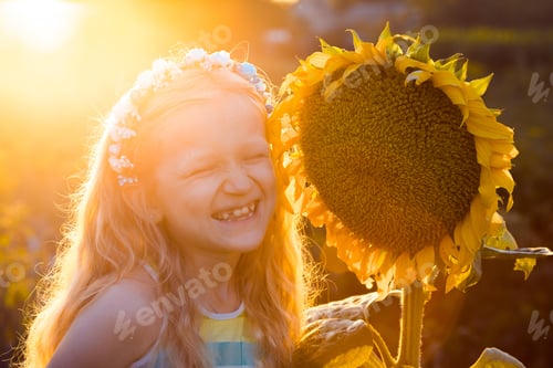 Preview: Smile Little Girl With Sunflower At The Sunset Time