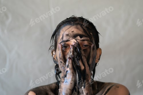 Preview: The Face Of A Young Beautiful Girl Is Painted Black