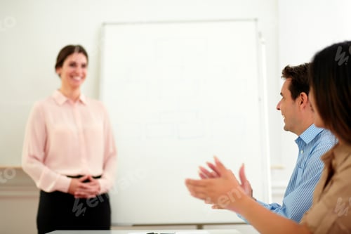 Preview: Portrait Of A Business Team Giving Applause To Pretty Businesswoman Who Is Standing On Office