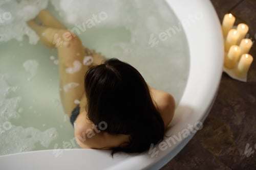 Preview: Beautiful Young Girl Relaxing Lying In Bathtube In Bathroom