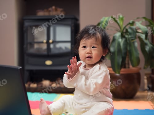 Preview: Baby Girl Playing Big Laptop