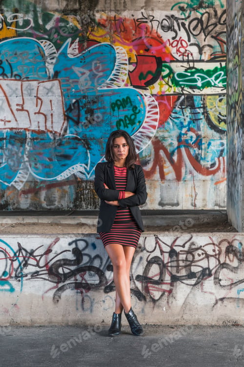 Preview: Beautiful Young Brunette With Long Hair Posing In An Urban Context