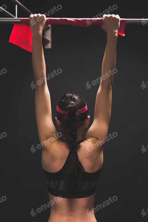 Preview: Beautiful Young Girl Doing Workout In The Gym. Concept Of Health And Fitness.