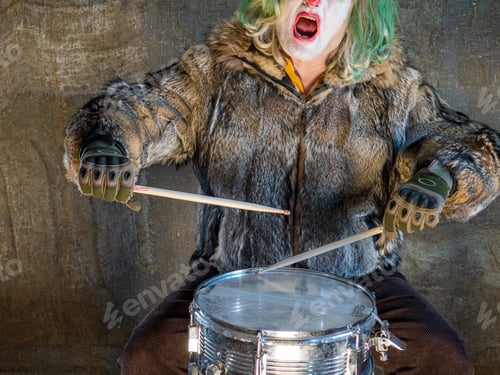 Preview: Crazy Aggressive Clown In Wolf Skin Plays Drum. Man Hates His Work In His Free Time, Dresses Like