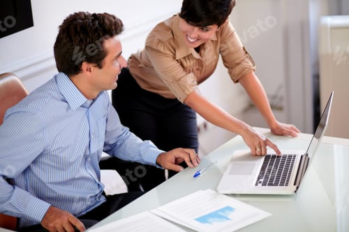 Preview: Portrait Of A Young Secretary Helping An Adult Businessman While Working With Her Laptop On Office