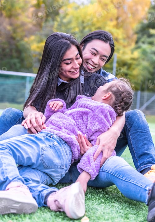 Preview: Happy Family Hugging In A Park
