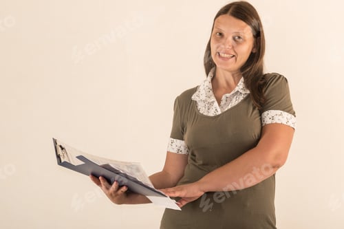 Preview: Young Beautiful Girl Prepares Business Papers For Viewing In Office. Concept Assistant Secretary.