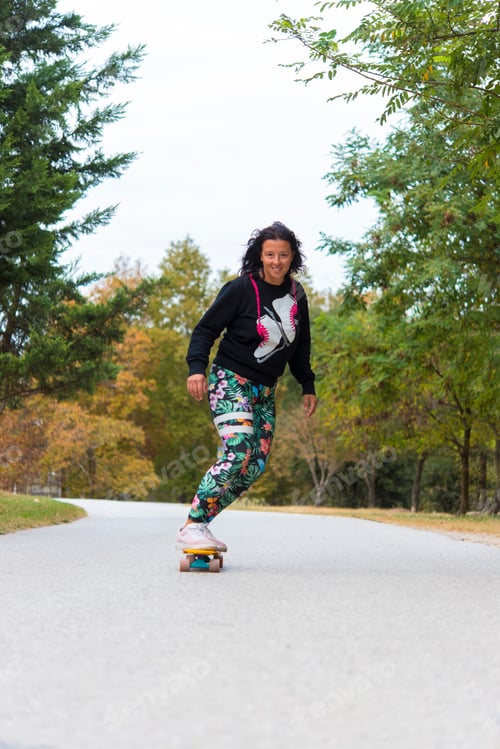Preview: Happy Young Skateboarder Having Fun With Skateboard On The Road