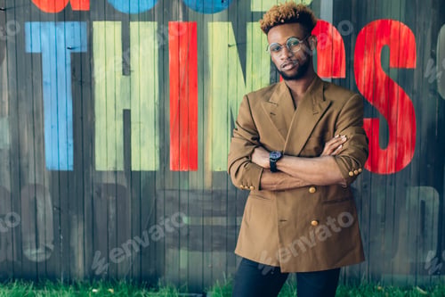 Preview: African American Man In A Jacket Near A Wooden Colored Wall