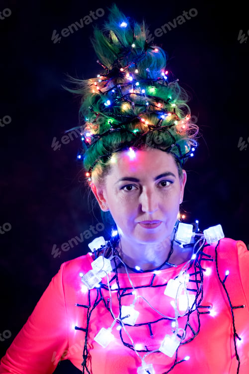 Preview: A Beautiful Girl In A Pink Dress With Green Hair Decorated Herself With Christmas Garlands. Her