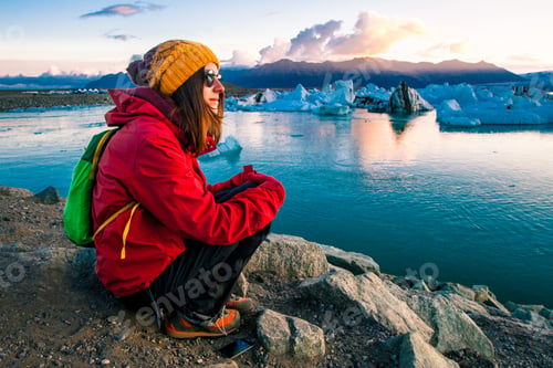 Preview: Woman In Bright Red Sport Jacket Near The Glacier Lagoon, Iceland