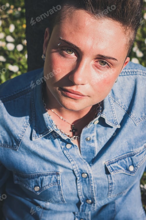 Preview: Short Hair Girl Sitting In The Grass With Flowers