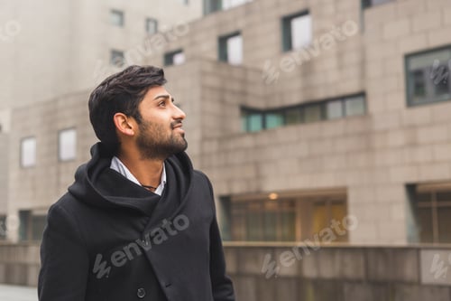 Preview: Portrait Of A Young Handsome Indian Man Posing In An Urban Context