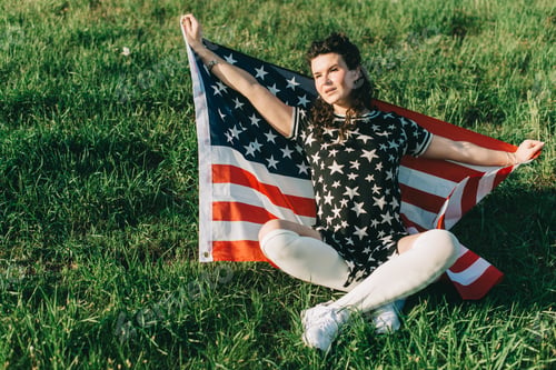 Preview: Girl With An American Flag. Independence Day Concept