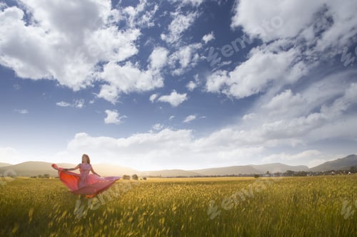 Preview: Young Woman Standing On A Wheat Field With Sunrise On The Background. Beauty Romantic Girl