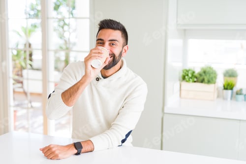 Preview: Handsome Man Smiling While Enjoying Drinking A Take Away Coffee In The Morning