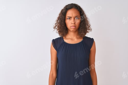 Preview: Young Brazilian Woman Wearing Blue Dress Standing Over Isolated White Background Skeptic And